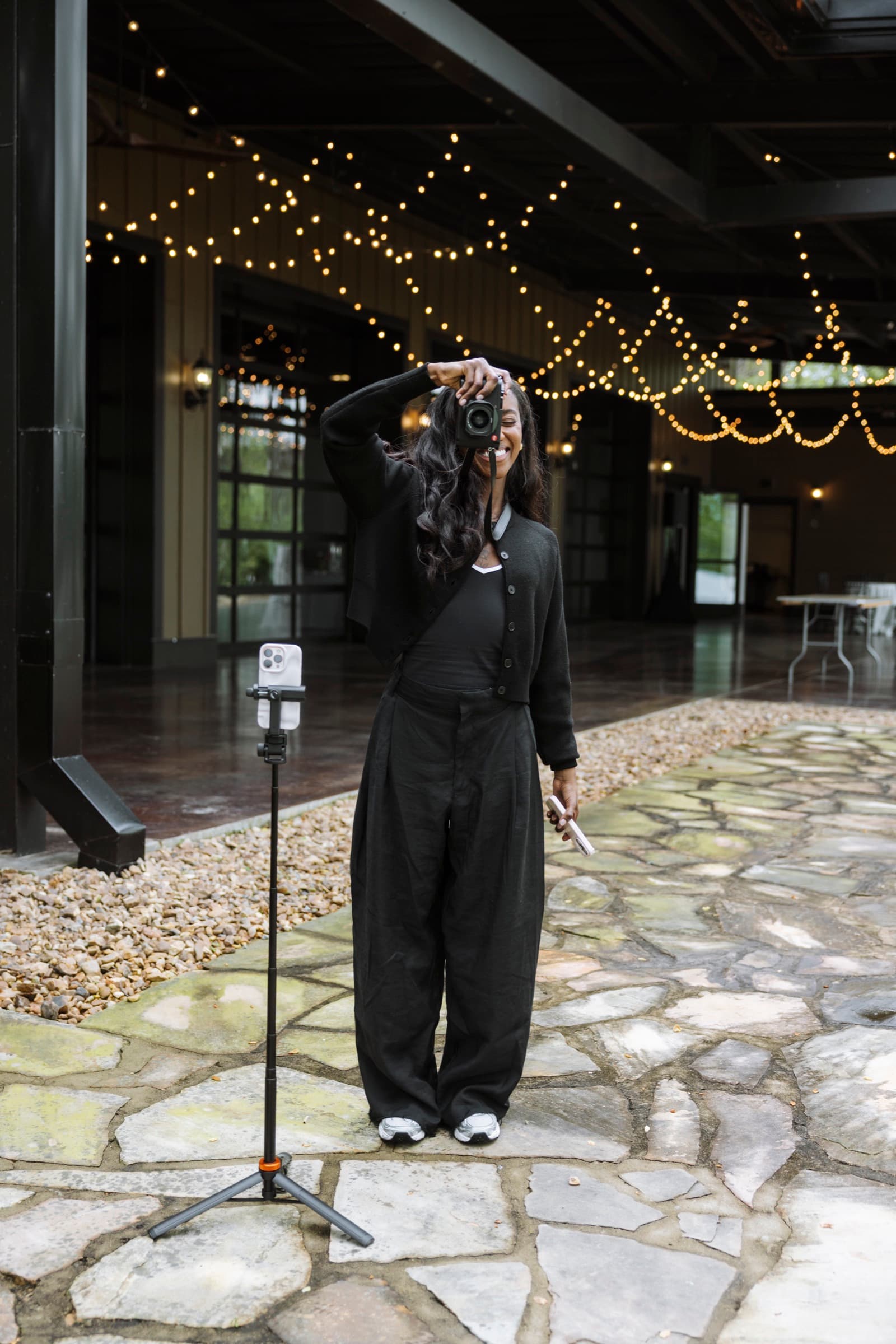 Judea full-body shooting with camera raised at a wedding