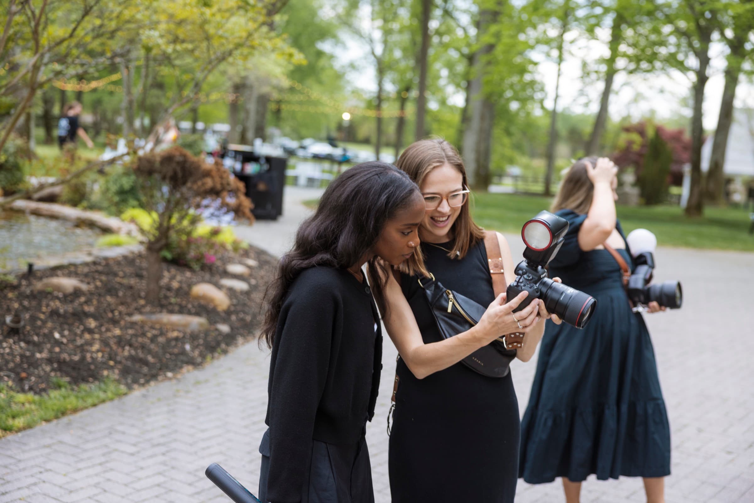 Judea and second shooter reviewing a camera LCD together