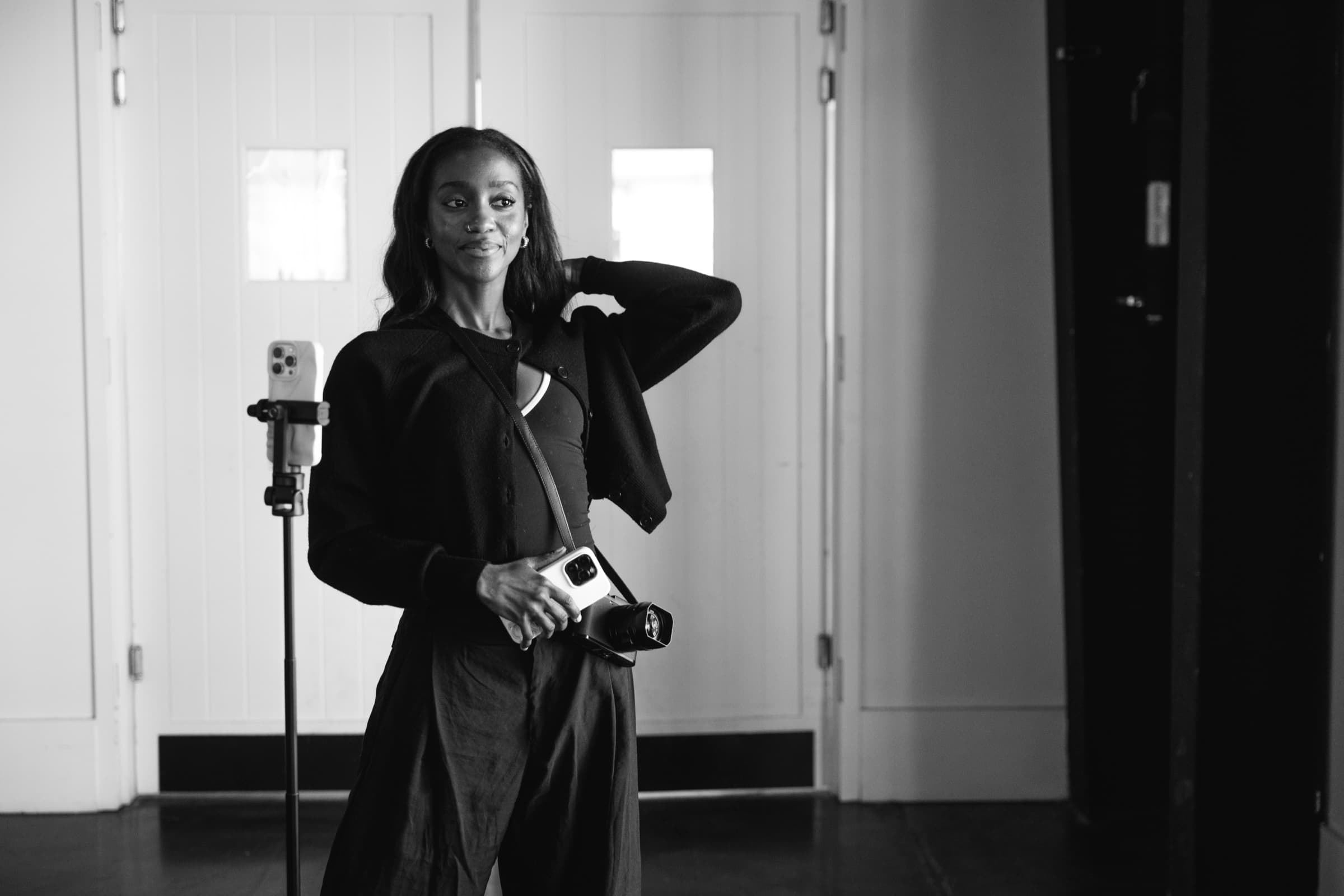 Black and white portrait of Judea smiling between shots